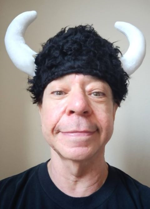 Joey Camen wearing a playful horned hat